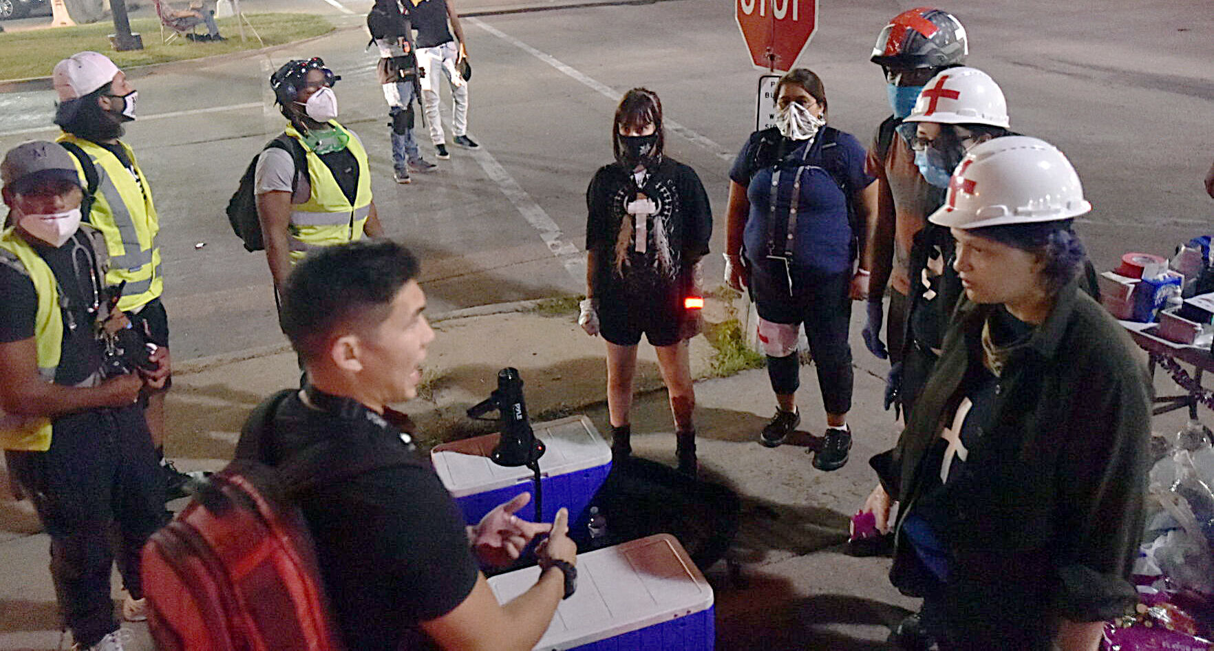 Street medics have a group huddle
